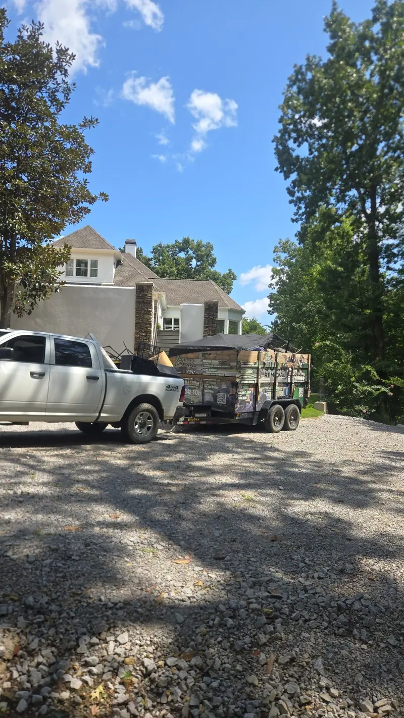 The Racoons pickup and dump trailer on a job